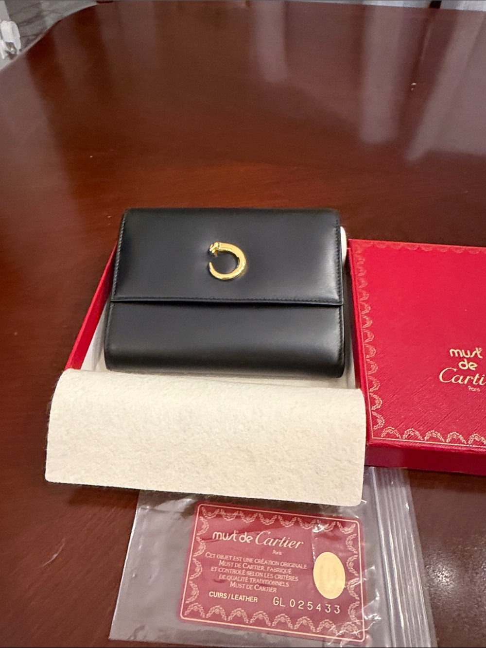 Cartier Black Leather Card Holder with Gold Crescent Accent